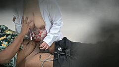 lady doctor chats playfully with patient in hospital setting