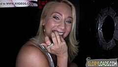 A hot woman is having fun with a cock through the gloryhole