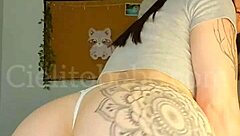 Argentinian dancer performs in white micro thong, showcasing her open ass