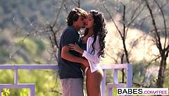 Ebony babe kisses and sucks cock.