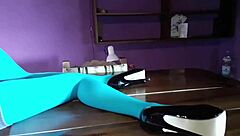 Milf with beautiful legs in pantyhose lies on desk