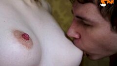 Close up shot of a guy licking and sucking big tits