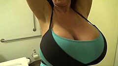 Mrs. James flaunts huge silicone breasts in a bikini