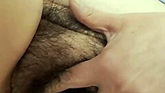 Mature milf reveals her thick hairy beaver while urinating at home