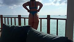 Stunning brunette gives amazing handjob on the terrace