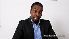 The black man has his way with a girl on the teacher's desk