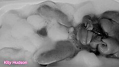 Kity hudson indulges in a steamy bath session with her favorite vibrator, reaching intense orgasms as her mature, hairy body responds eagerly.