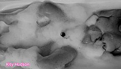 Kity hudson indulges in a steamy bath session with her favorite vibrator, reaching intense orgasms as her mature, hairy body responds eagerly.