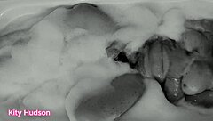 Kity hudson indulges in a steamy bath session with her favorite vibrator, reaching intense orgasms as her mature, hairy body responds eagerly.