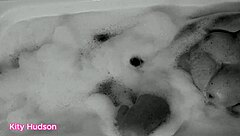 Kity hudson indulges in a steamy bath session with her favorite vibrator, reaching intense orgasms as her mature, hairy body responds eagerly.