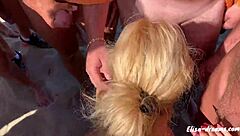 horny milf masturbates publicly at beach, receiving cumshots