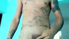 Skinny guy shows off his banana toy in the living room