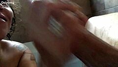 Mom gives handjob to big cock in bathtub