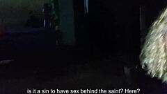 Couple in public behind church