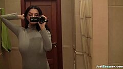 Busty Babe Fingers Her Hairy Pussy In The Bathroom!