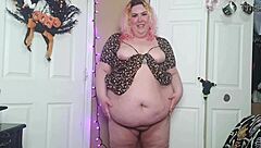A desperate fat woman in a sun dress is caught in a compromising act