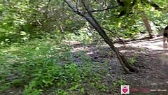 Teen shows natural tits and ass in forest nude