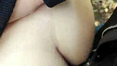 A guy has sex with his girlfriend outdoors