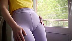 My stepsister is showing off her legs and wet pussy through her workout pants