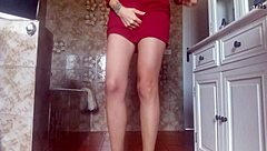 A cute, playful girl in a diaper, peeing unexpectedly