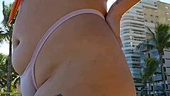 Woman Flashes Tits To Pay At Beach