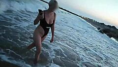 Blonde boldly flashes tits and sucks cock on public beach
