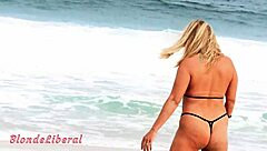 Exhibiting on the beach to strange guys in a micro bikini by the river