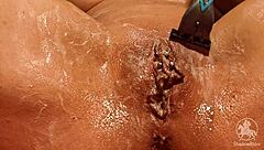 Woman in Bathroom Trims Her Wet Pussy Lips and Clit with Tattoo Visible