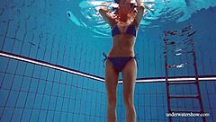 blue bikini hugs martina's tight pussy underwater suggestively