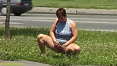 Redhead MILF with big ass pees in public