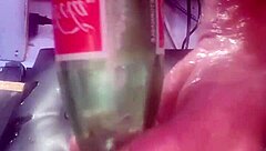A big bottle was inserted into the tight ass hole
