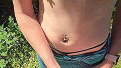 Wife gives quick handjob outdoor with pierced nipples