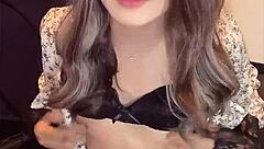 I filmed this beautiful asian ladyboy masturbating quietly in her one-piece dress.