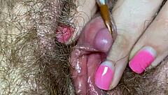 Focusing on clitoral edge with extreme close up camera shot