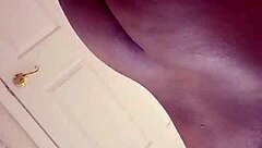 The girl masturbates in front of the mirror and achieves orgasm