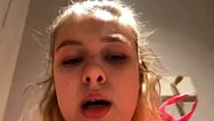 Young woman performs extreme anal fingering outdoors on webcam.