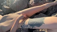 Exhibitionist woman plays with herself on the beach