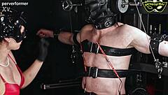 The slave gets shocked with electricity on his balls and cock