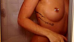 Babe fucks herself in the shower with a dildo