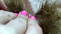 A girl achieves orgasm by rubbing her huge clitoris