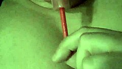 Girl plays with her tits while sucking a lollipop