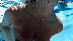 Ukrainian milf swims underwater in pool