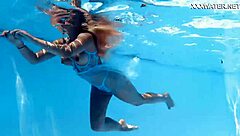 Ukrainian milf swims underwater in pool