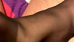 Giving the hubby a footjob in black reinforced toe stockings