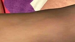 Giving the hubby a footjob in black reinforced toe stockings