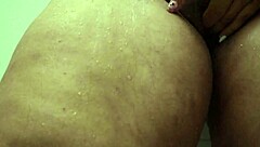 Oh man, check out this big ass Colombian bbw masturbating her wet pussy in the shower