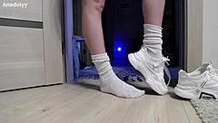 delicate legs in sneakers are waiting for you in the shower