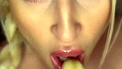 Horny girl sucks banana