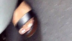 Mature Woman Hides Her Feet in Wedges and Sandals During Candid Moment