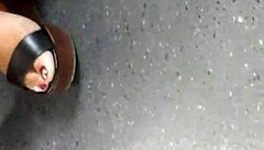 Mature Woman Hides Her Feet in Wedges and Sandals During Candid Moment